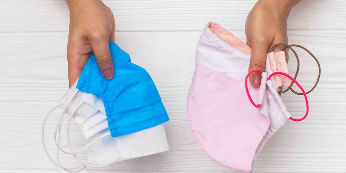 hands-holding-reusable-face-masks-and-single-use-m-2021-08-29-03-31-38-utc-min (1)